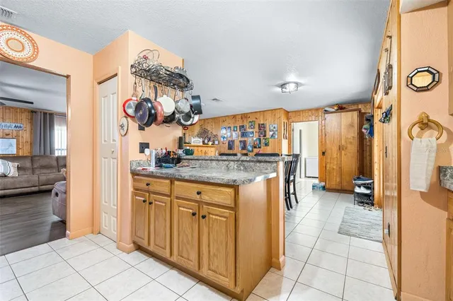 a kitchen with stainless steel appliances granite countertop a sink and cabinets