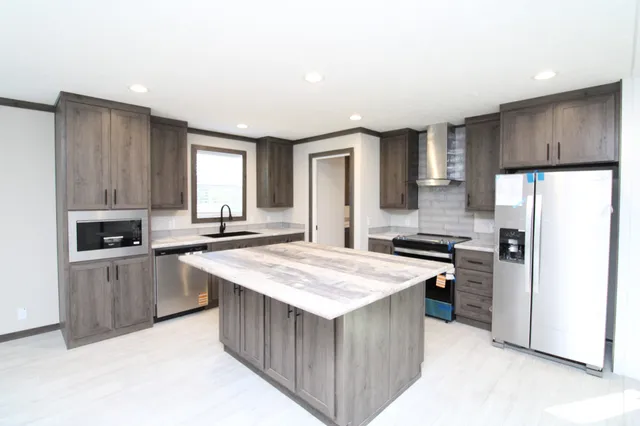 a kitchen with a stove a refrigerator a sink and a refrigerator