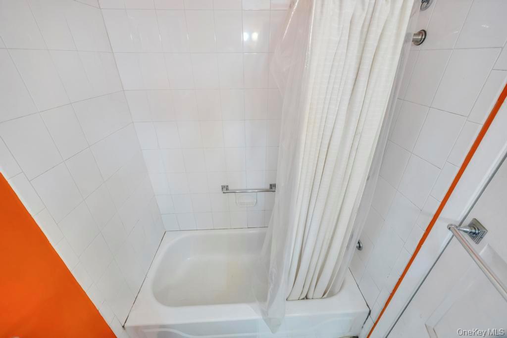 89 Van Brunt Manor Road Setauket, NY 11733 - Photo 24 of 41 a bathroom with a tub