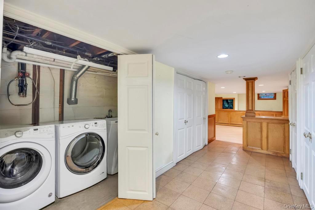 89 Van Brunt Manor Road Setauket, NY 11733 - Photo 37 of 41 a view of a kitchen with refrigerator and cabinets