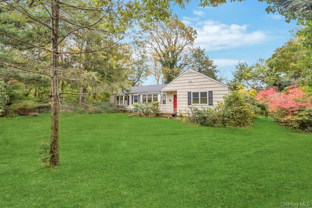 89 Van Brunt Manor Road Setauket, NY 11733 - Photo 8 of 41 a front view of a house with garden