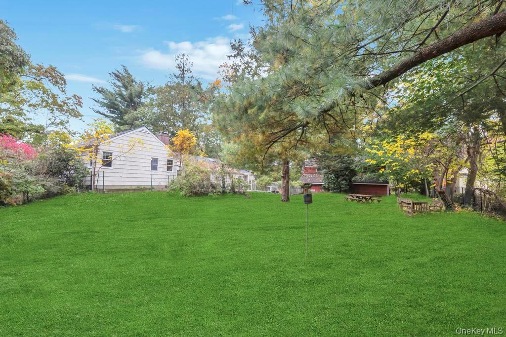 89 Van Brunt Manor Road Setauket, NY 11733 - Photo 10 of 41 a view of a house with a yard