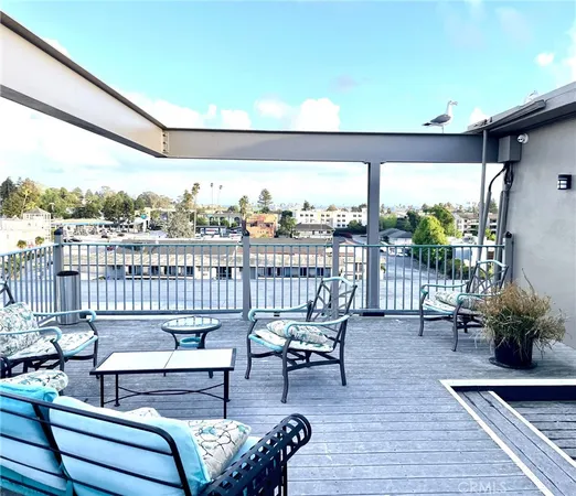 an aerial view of a house with a swimming pool patio and outdoor seating