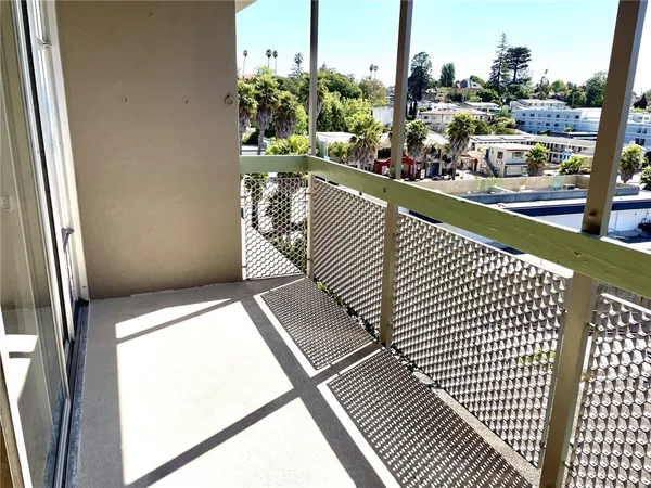 a view of a balcony with wooden floor