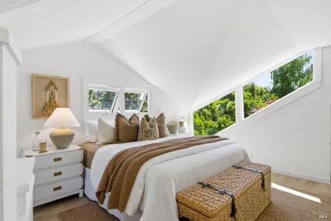 a bedroom with a bed and a table