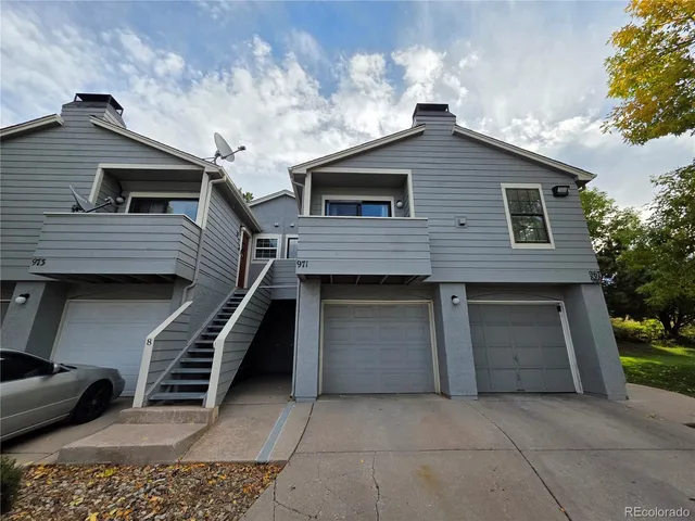 a front view of a house with garage