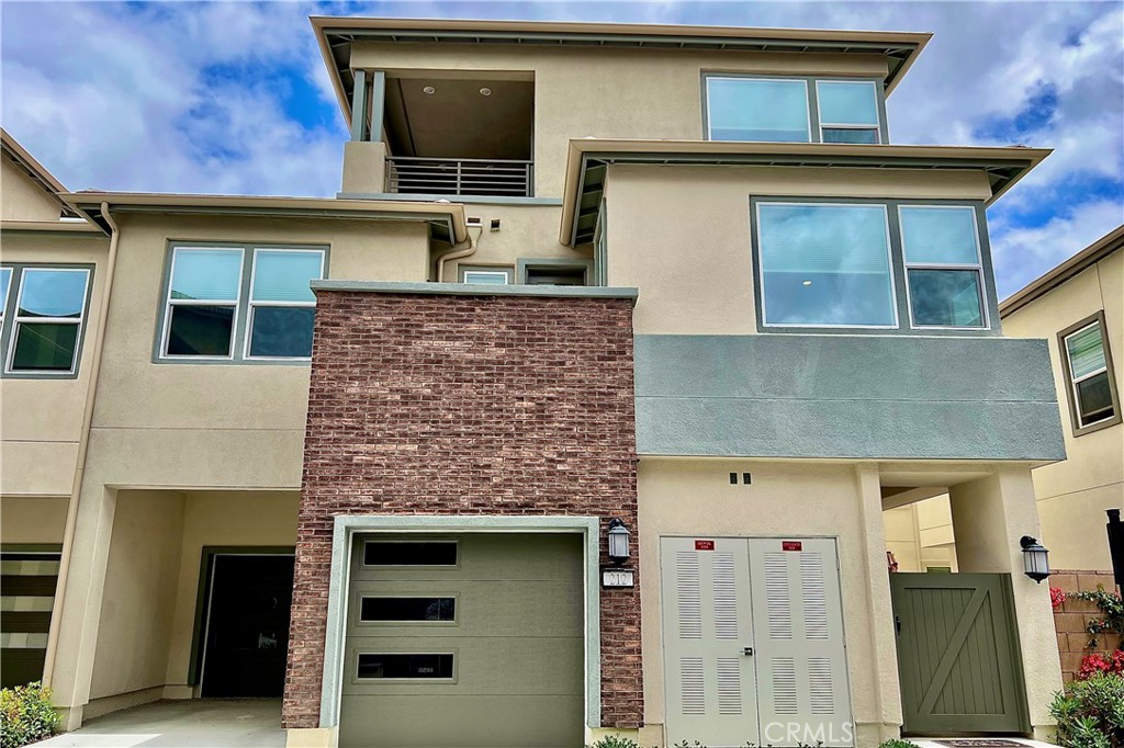 a front view of a house with a garage