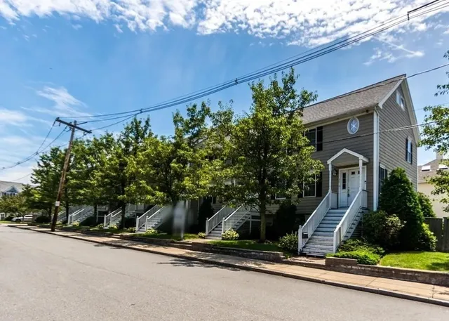 a house with a tree in front of it
