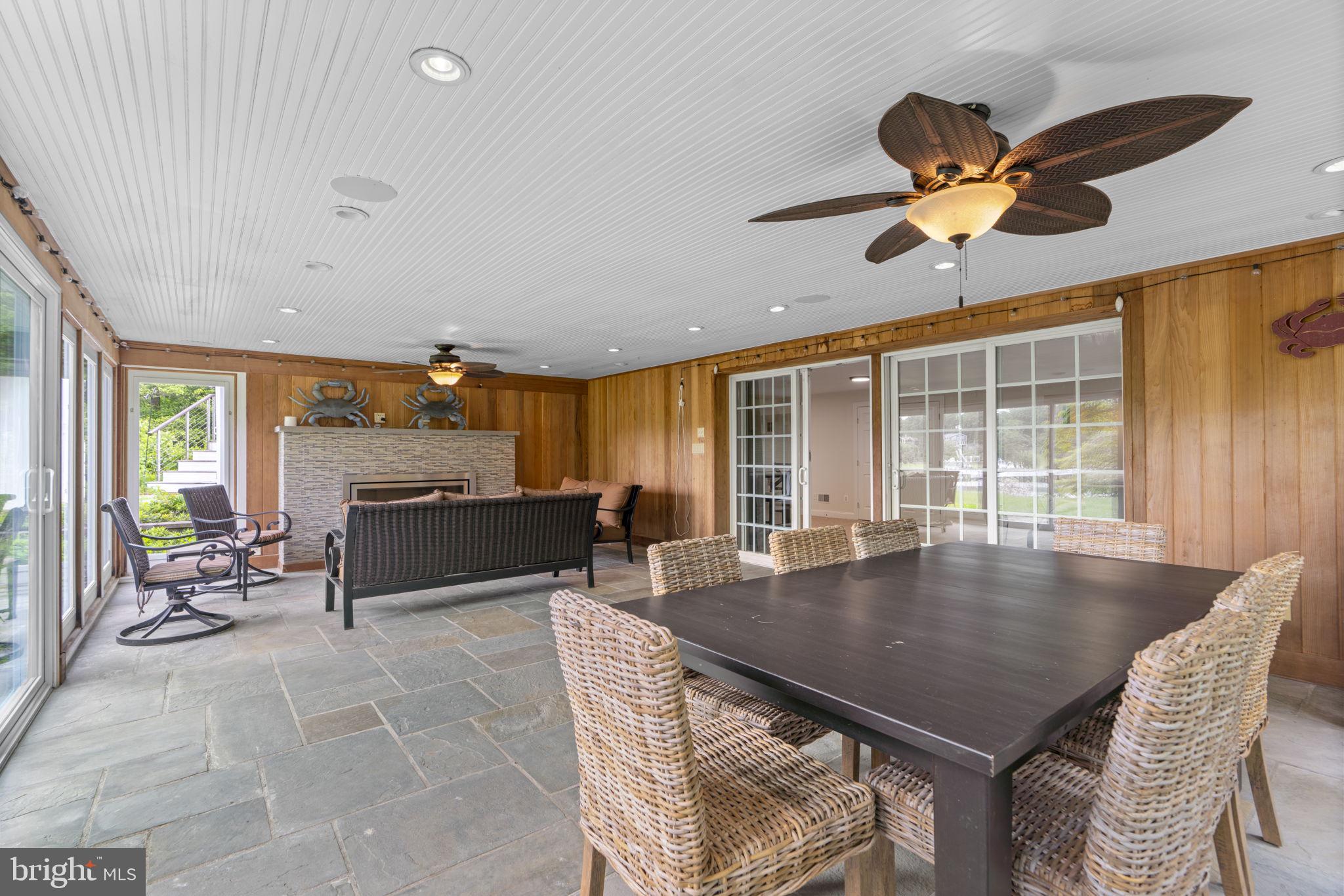 798 Creek View Road Severna Park, MD 21146 - Photo 56 of 72 a living room with furniture a window and a ceiling fan