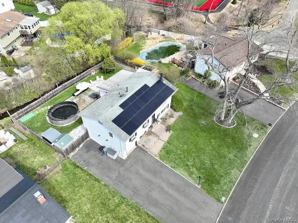 an aerial view of house with yard
