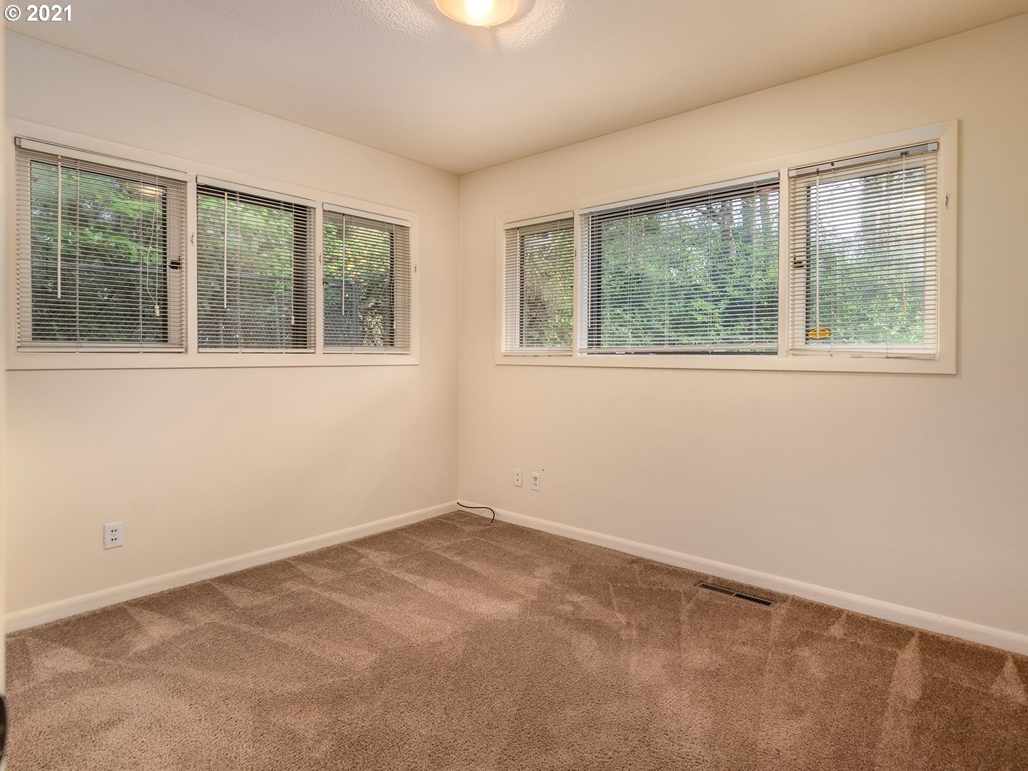 3480 Southwest Talbot Road Portland, OR 97239 - Photo 23 of 32 an empty room with a window