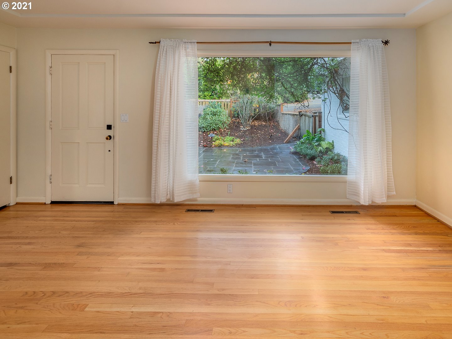 3480 Southwest Talbot Road Portland, OR 97239 - Photo 5 of 32 a view of a room with wooden floor and front door