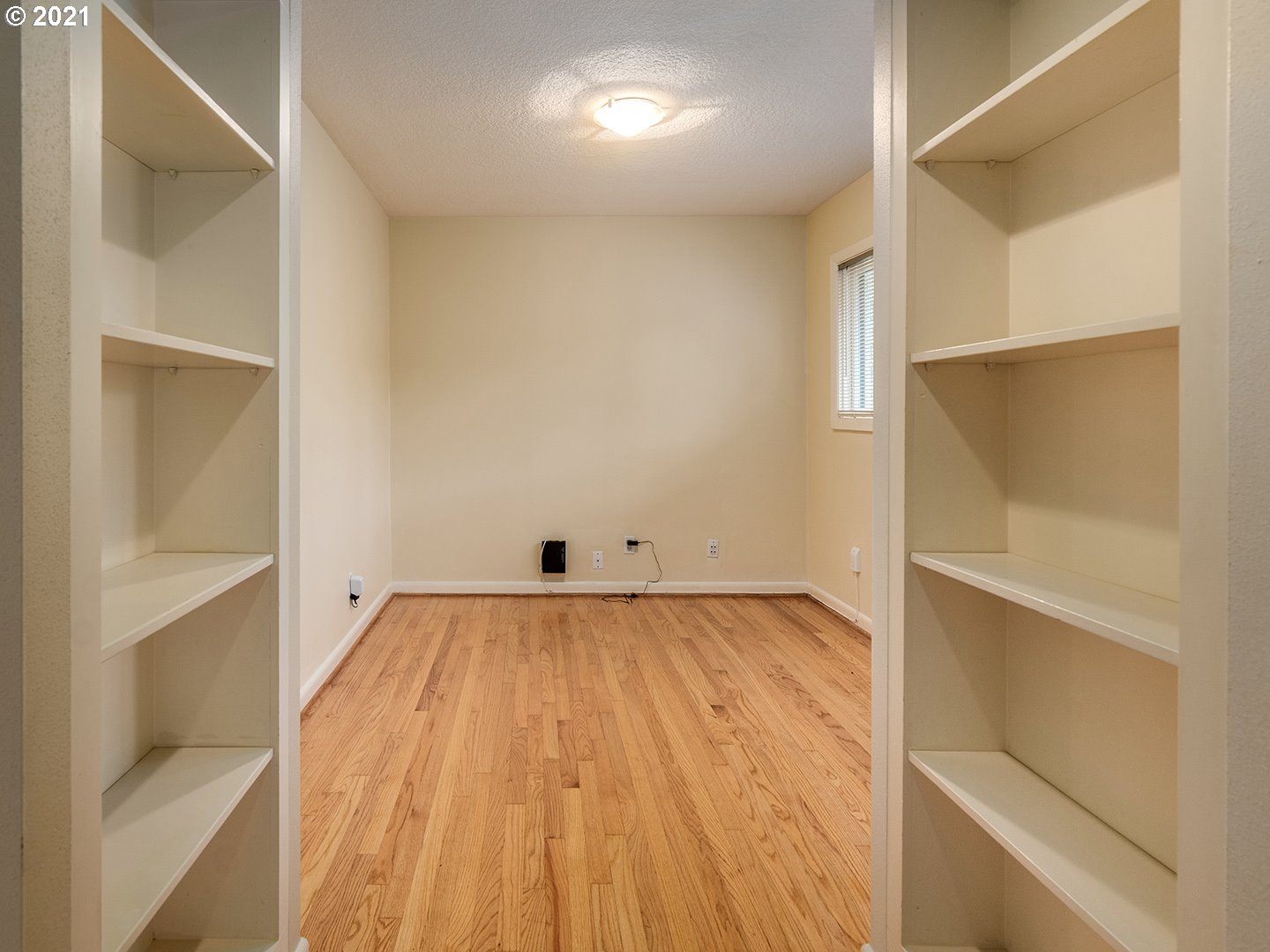 3480 Southwest Talbot Road Portland, OR 97239 - Photo 9 of 32 a view of a room with wooden floor and brick walls