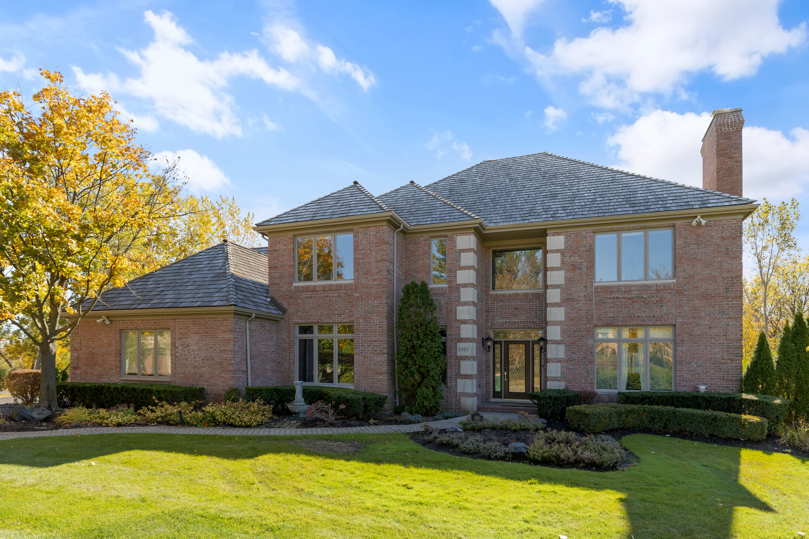a front view of a house with a yard