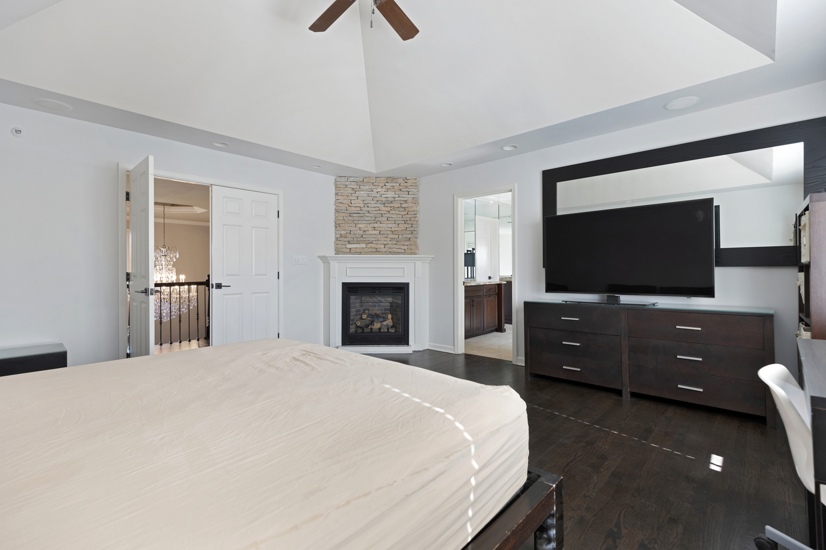 4469 Kettering Drive Long Grove, IL 60047 - Photo 17 of 45 a bedroom with a bed and a flat screen tv