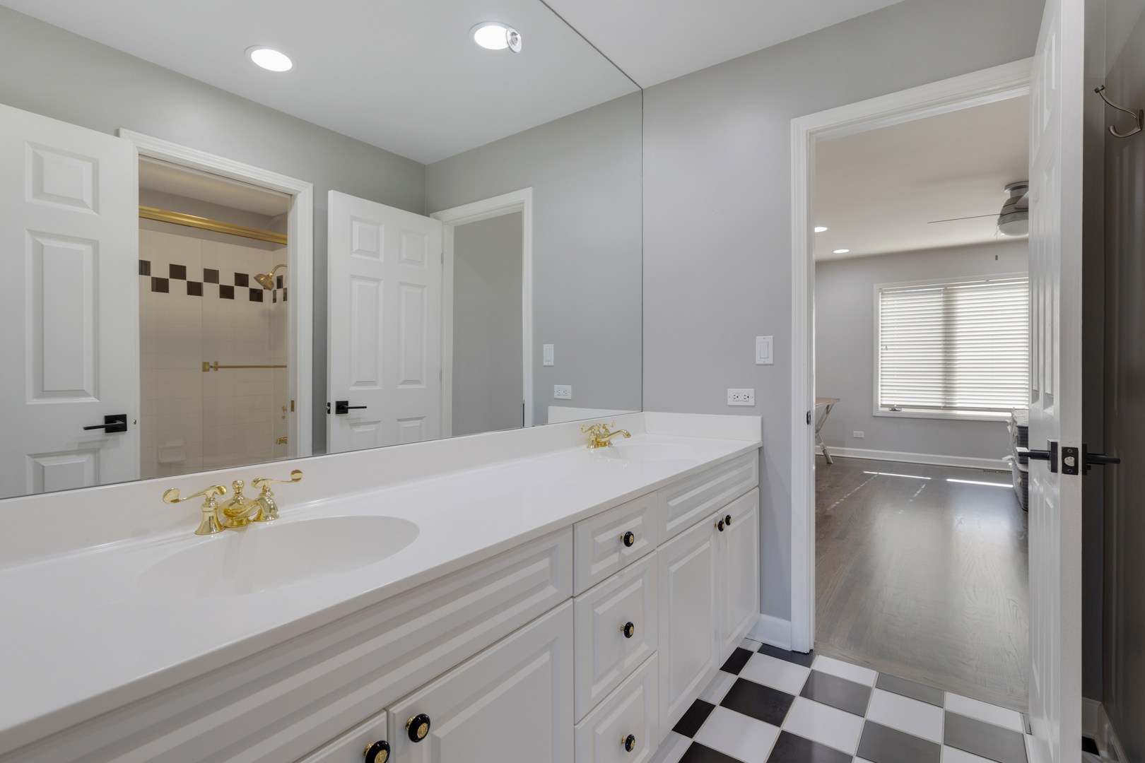 4469 Kettering Drive Long Grove, IL 60047 - Photo 26 of 45 a bathroom with a granite countertop sink mirror and bathtub