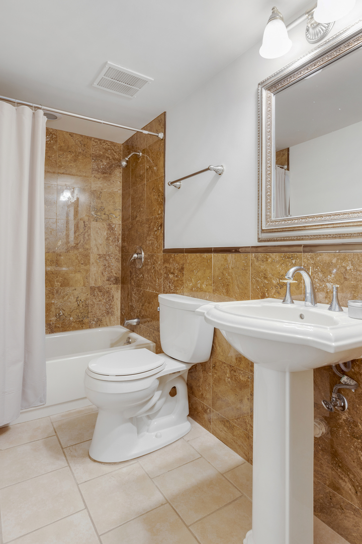 4469 Kettering Drive Long Grove, IL 60047 - Photo 35 of 45 a bathroom with a sink toilet and shower