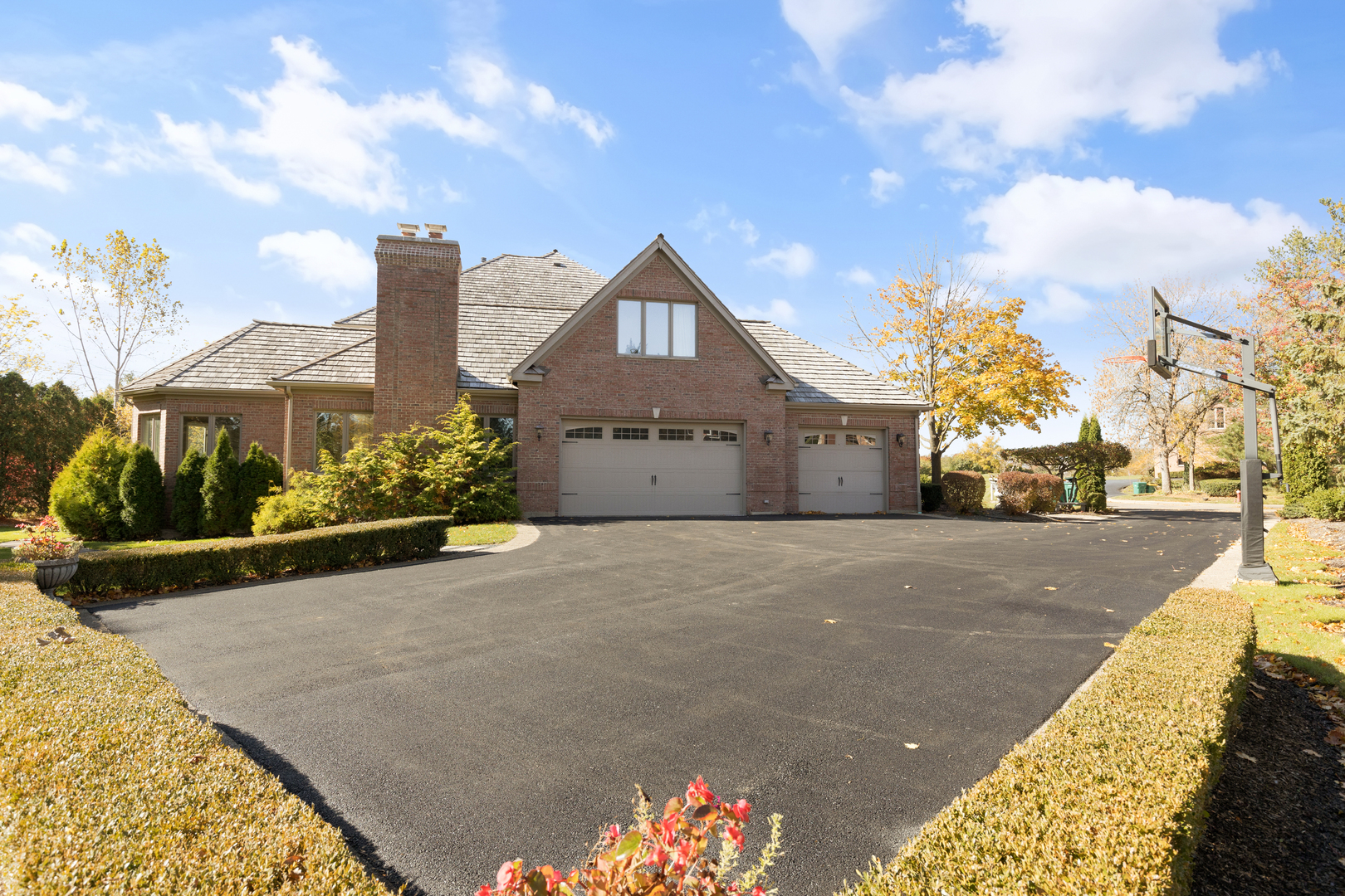 4469 Kettering Drive Long Grove, IL 60047 - Photo 36 of 45 a front view of a house with a yard and garage