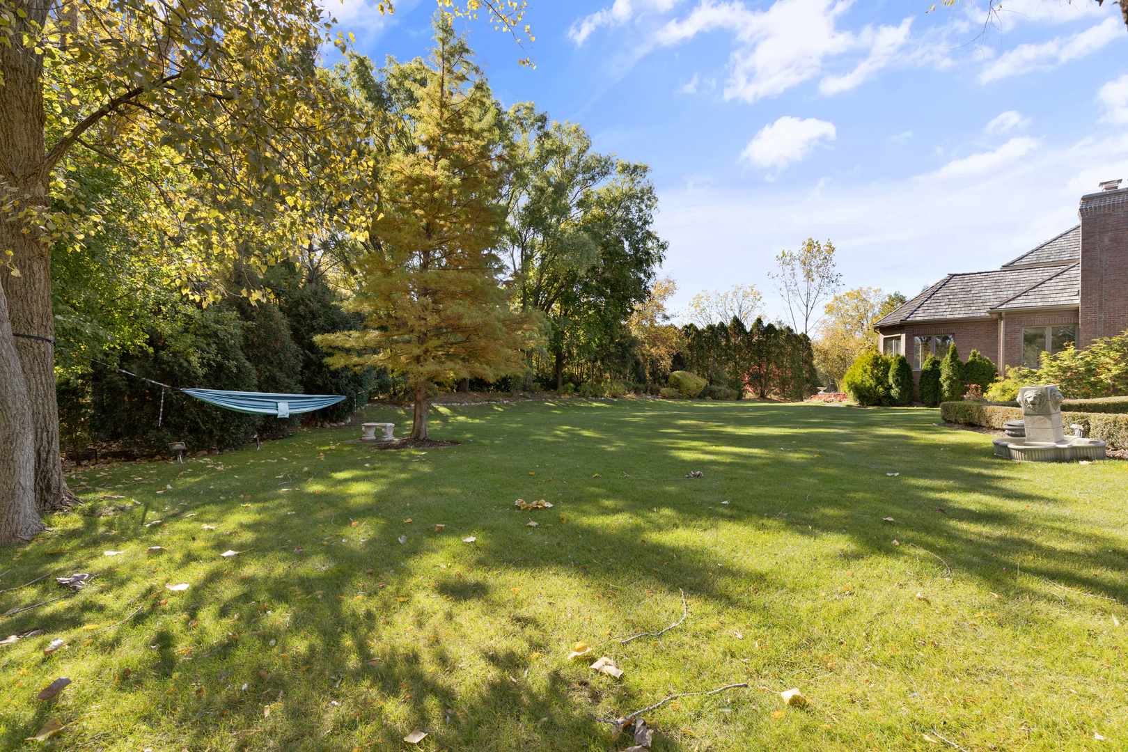 4469 Kettering Drive Long Grove, IL 60047 - Photo 41 of 45 a swimming pool with some trees in the background
