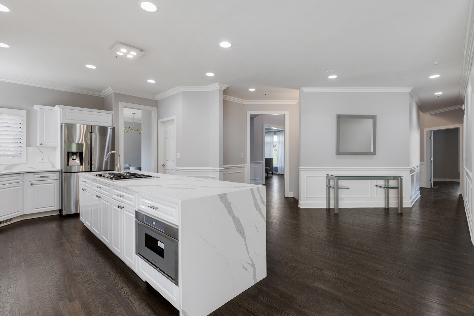 4469 Kettering Drive Long Grove, IL 60047 - Photo 5 of 45 a large white kitchen with a stove top oven