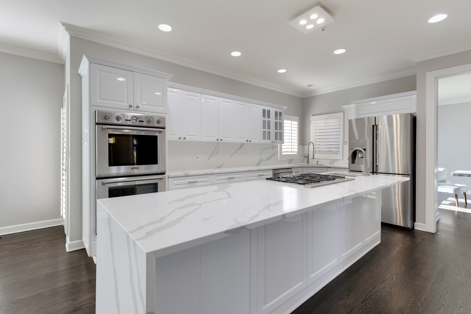 4469 Kettering Drive Long Grove, IL 60047 - Photo 7 of 45 a kitchen with stainless steel appliances a stove a sink and a refrigerator