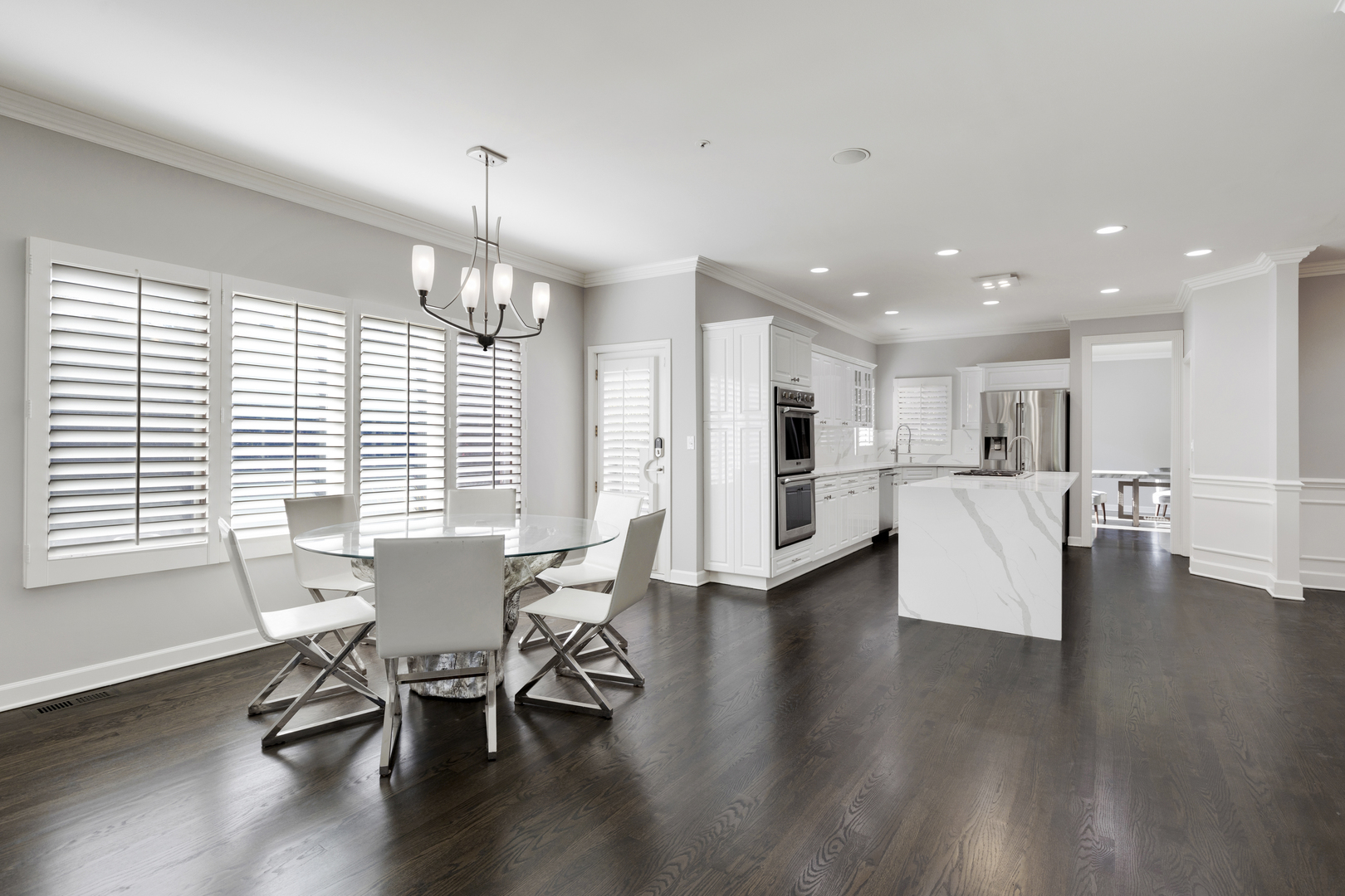 4469 Kettering Drive Long Grove, IL 60047 - Photo 8 of 45 a view of a dining room with furniture and wooden floor