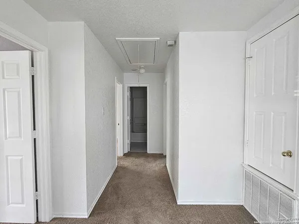 a view of a hallway with an empty room