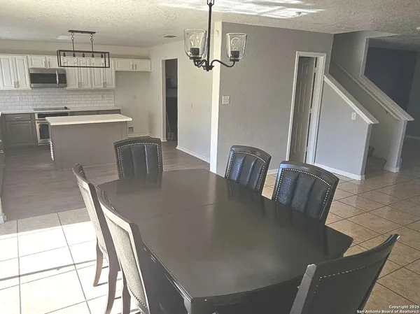a view of a dining room with furniture window and outside view