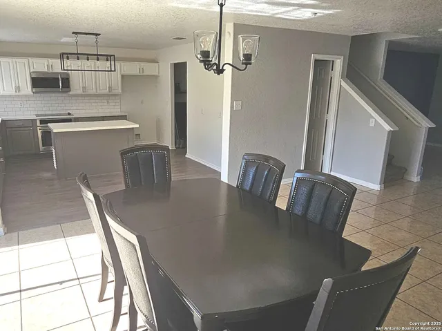 a view of a dining room with furniture window and outside view
