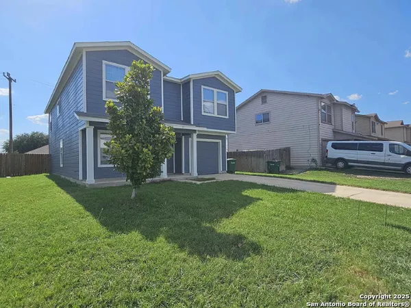 a house view with a garden space