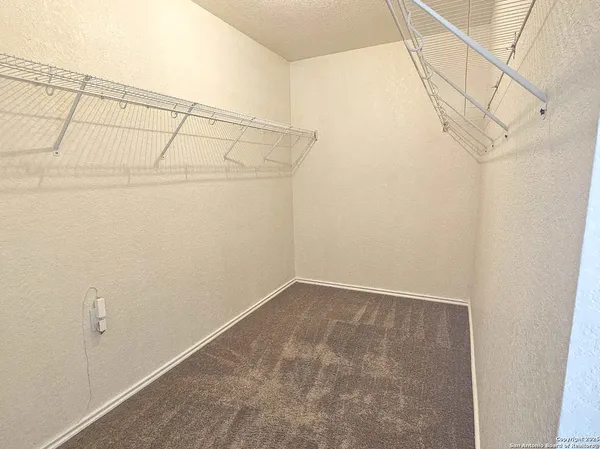 a view of a room with racks on the wall