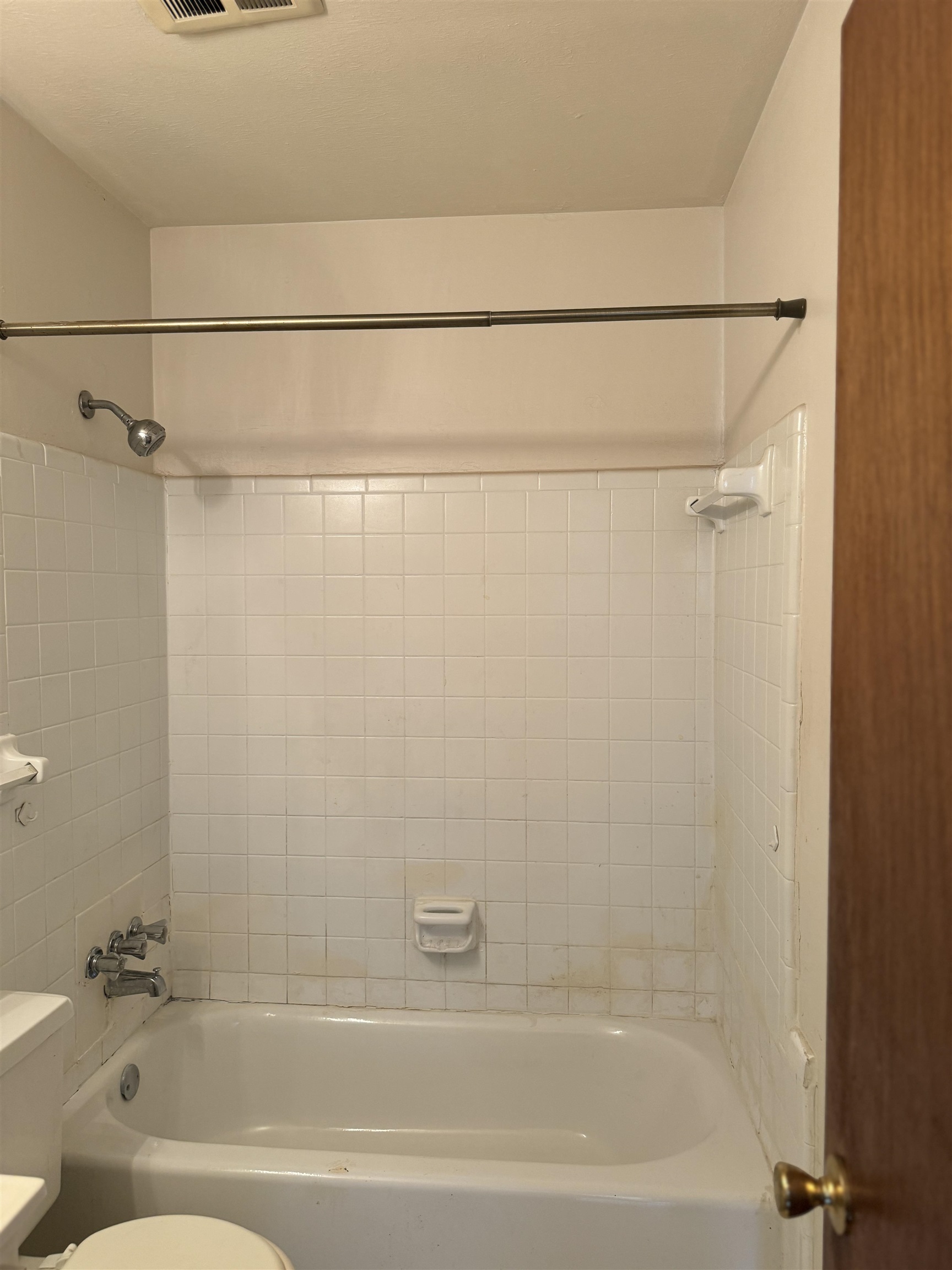 3289 Graves Road Memphis, TN 38116 - Photo 16 of 23 a bathroom with a shower and a bath tub