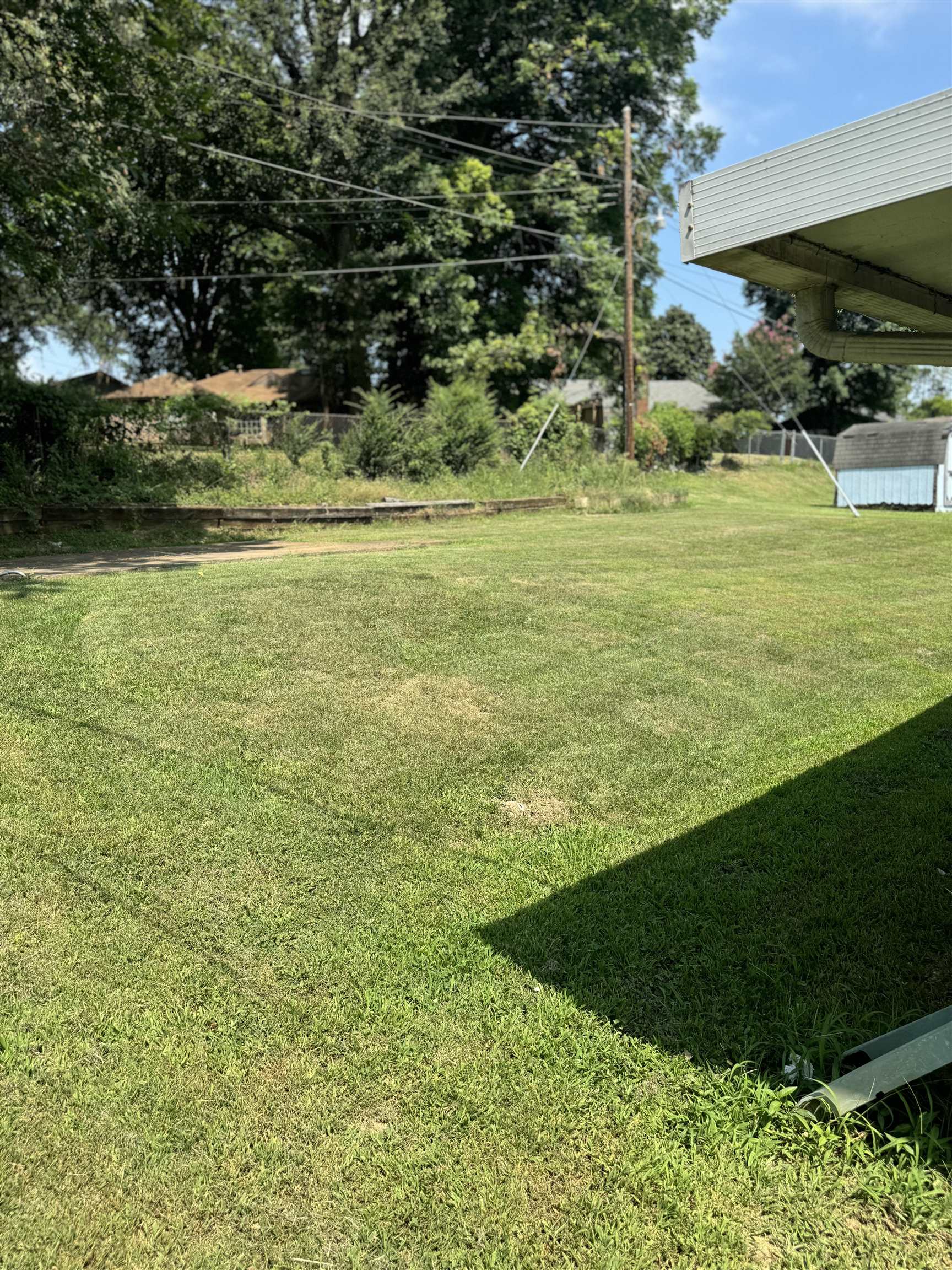 3289 Graves Road Memphis, TN 38116 - Photo 22 of 23 a view of a golf course with a lake