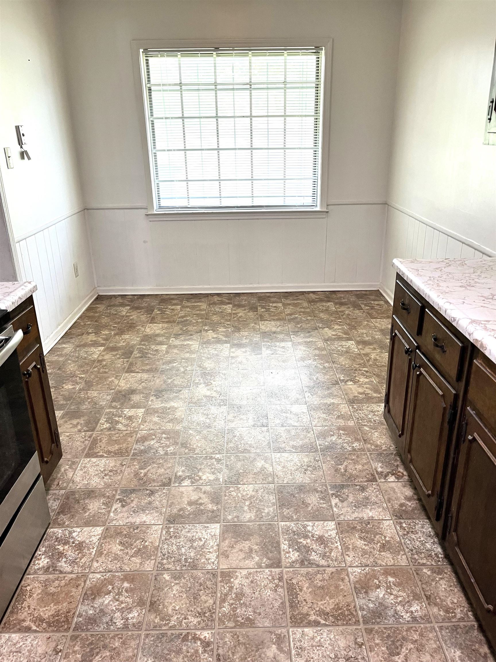 3289 Graves Road Memphis, TN 38116 - Photo 6 of 23 an empty room with wooden floor and a window