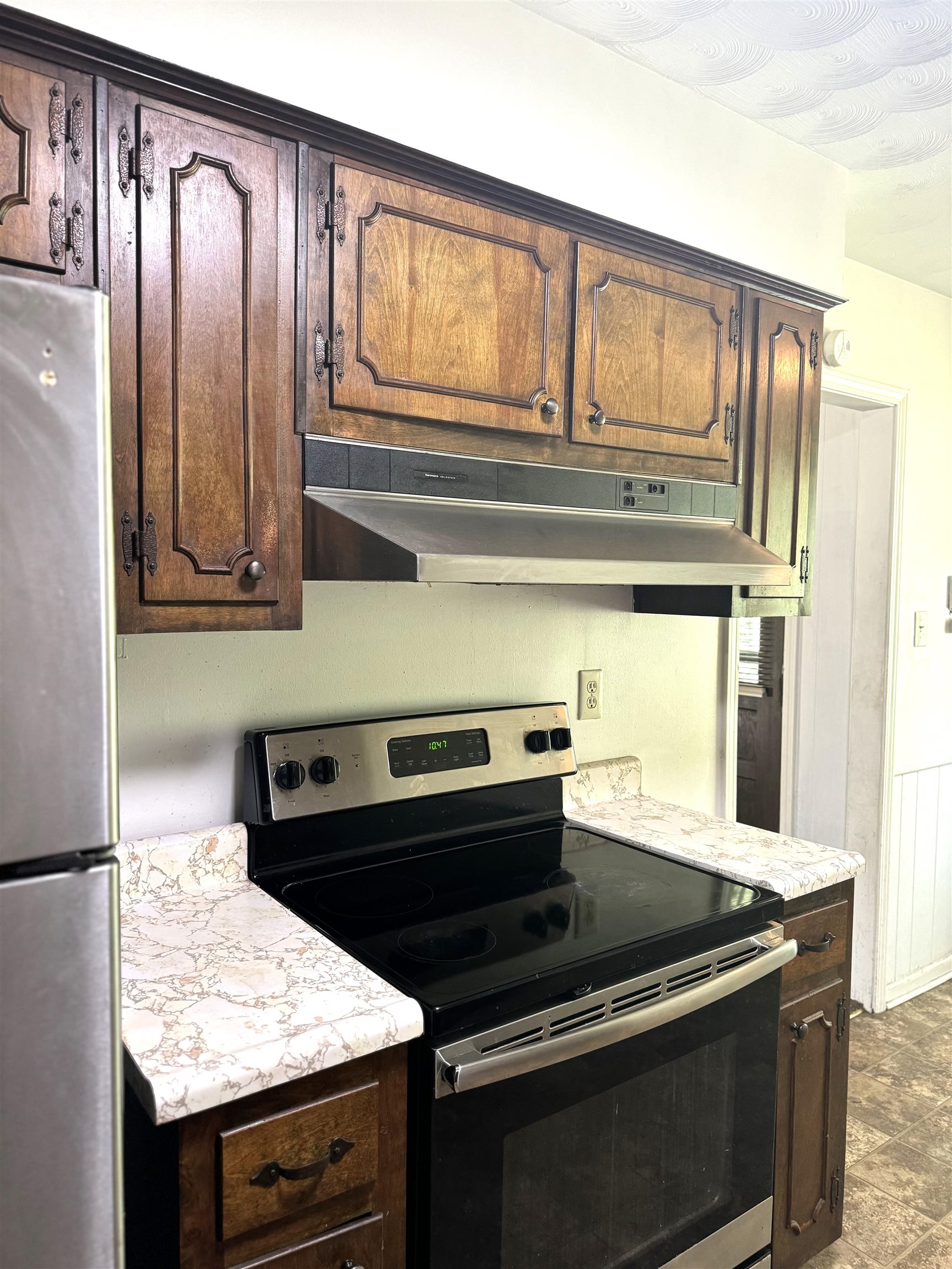 3289 Graves Road Memphis, TN 38116 - Photo 7 of 23 a kitchen with granite countertop a stove and a sink