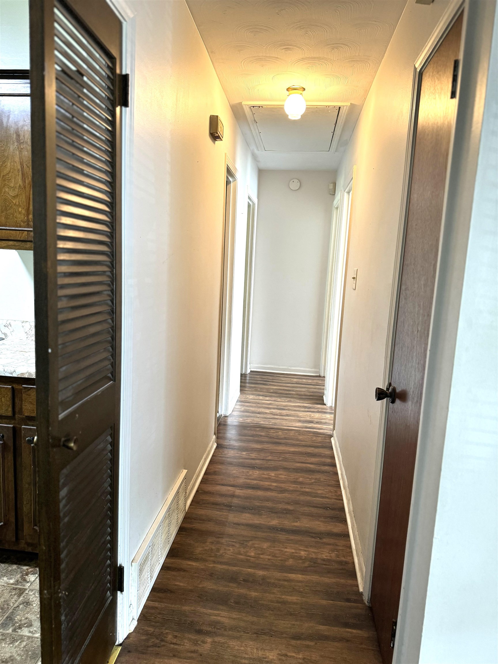 3289 Graves Road Memphis, TN 38116 - Photo 10 of 23 a view of a hallway with wooden floor