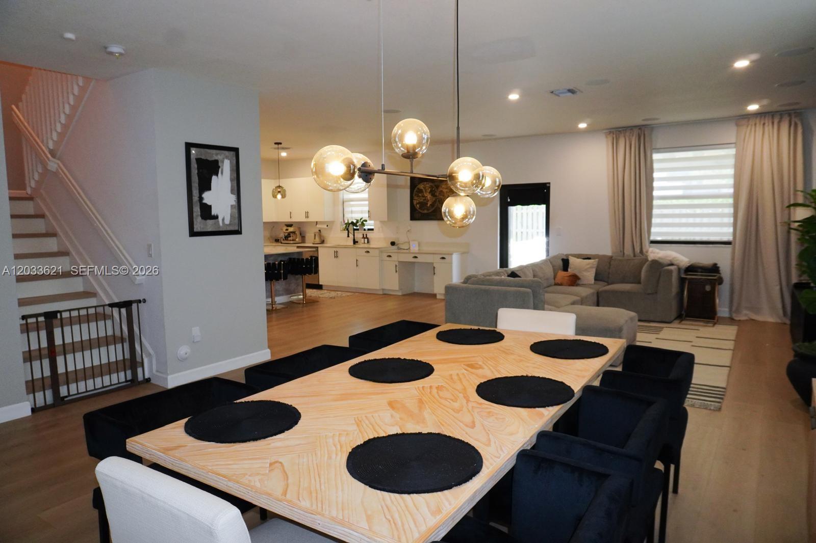 11942 Southwest 243rd Street Homestead, FL 33032 - Photo 6 of 50 a kitchen with a table chairs and a dining table