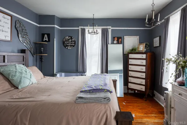 a bedroom with bed and cabinets