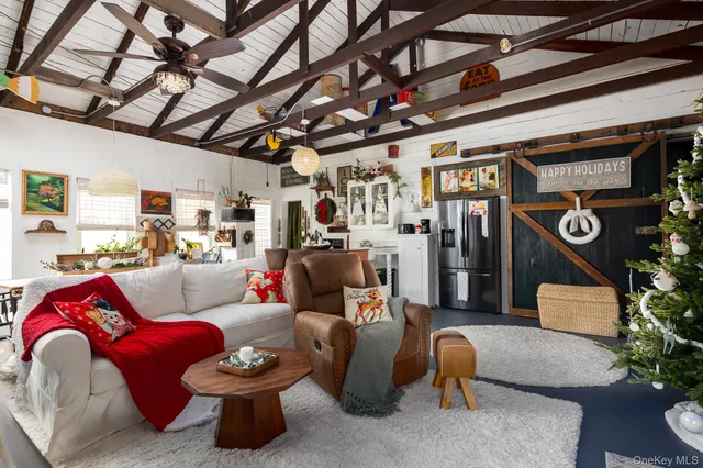 a living room with furniture and a clock