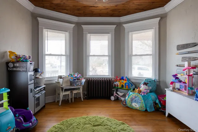a living room filled with furniture and a window