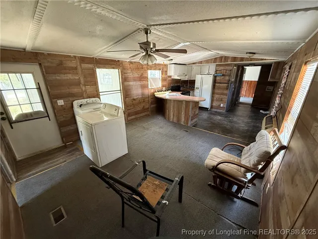 a living room with lots of furniture and a window