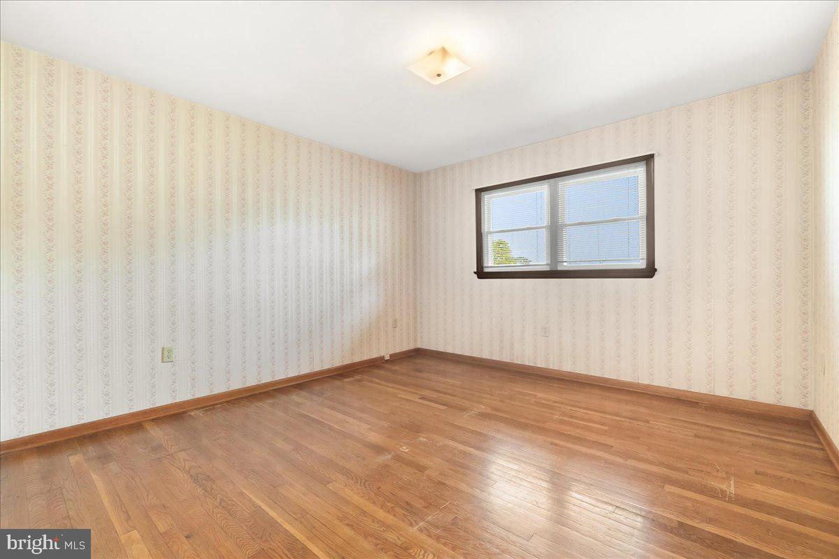 6010 Keysville Road Keymar, MD 21757 - Photo 20 of 64 a view of an empty room with wooden floor and a window