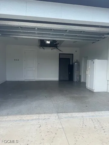a refrigerator sitting inside of a kitchen