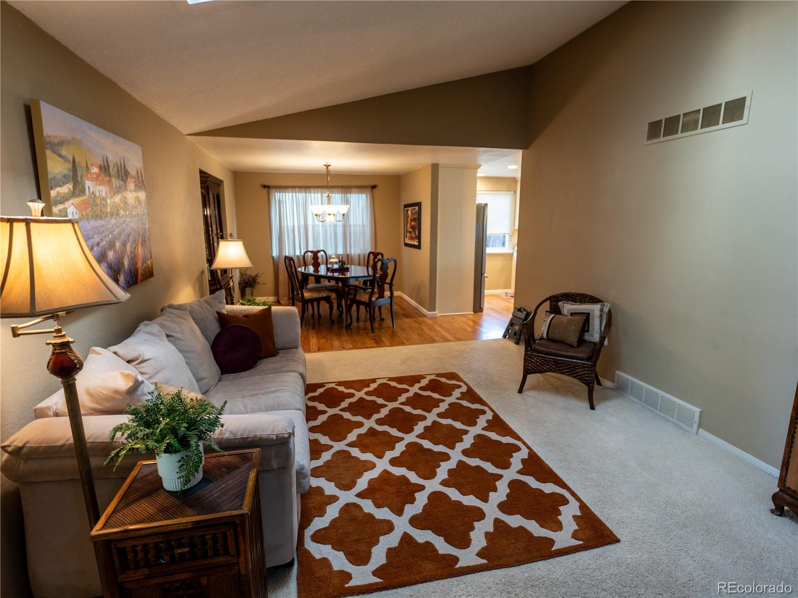 8908 Jellison Court Westminster, CO 80021 - Photo 3 of 17 a living room with furniture and a rug