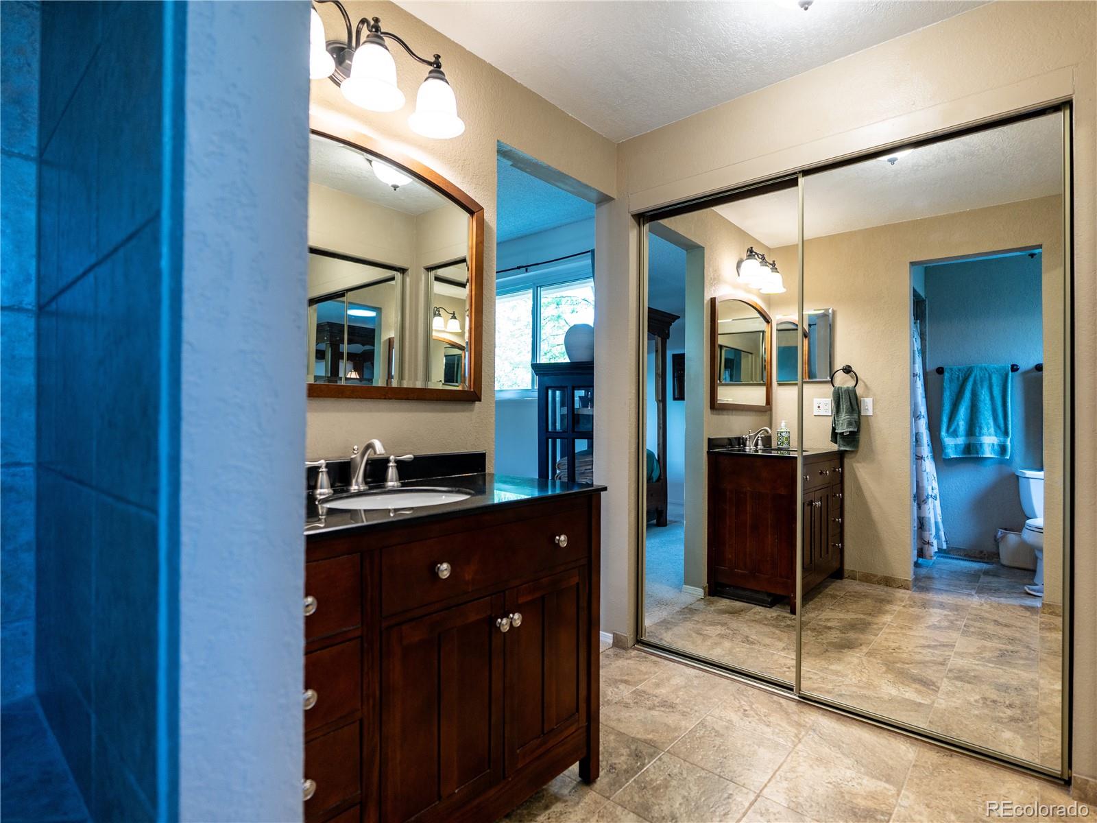8908 Jellison Court Westminster, CO 80021 - Photo 9 of 17 a kitchen with a refrigerator and a sink