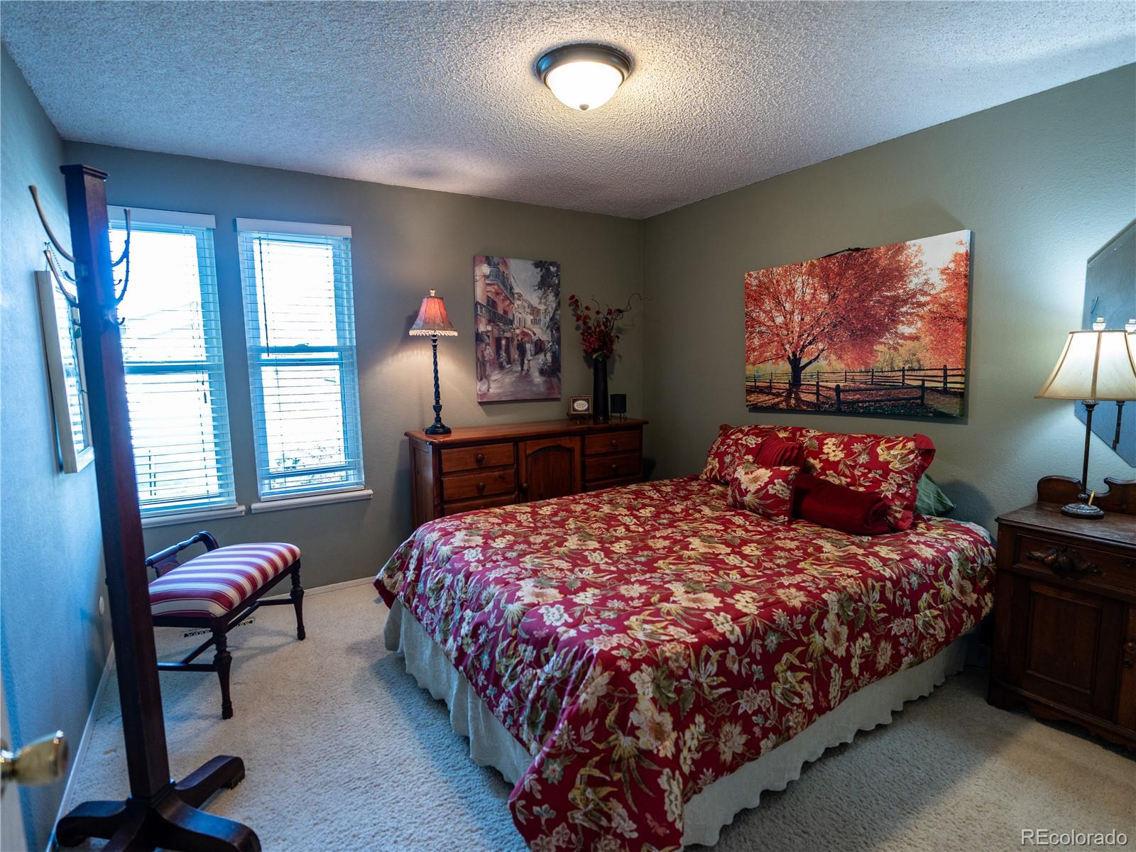 8908 Jellison Court Westminster, CO 80021 - Photo 10 of 17 a bedroom with a bed and a window