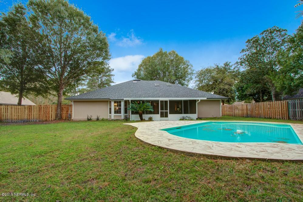 3038 Nautilus Road Middleburg, FL 32068 - Photo 1 of 45 a view of a house with a yard and trees