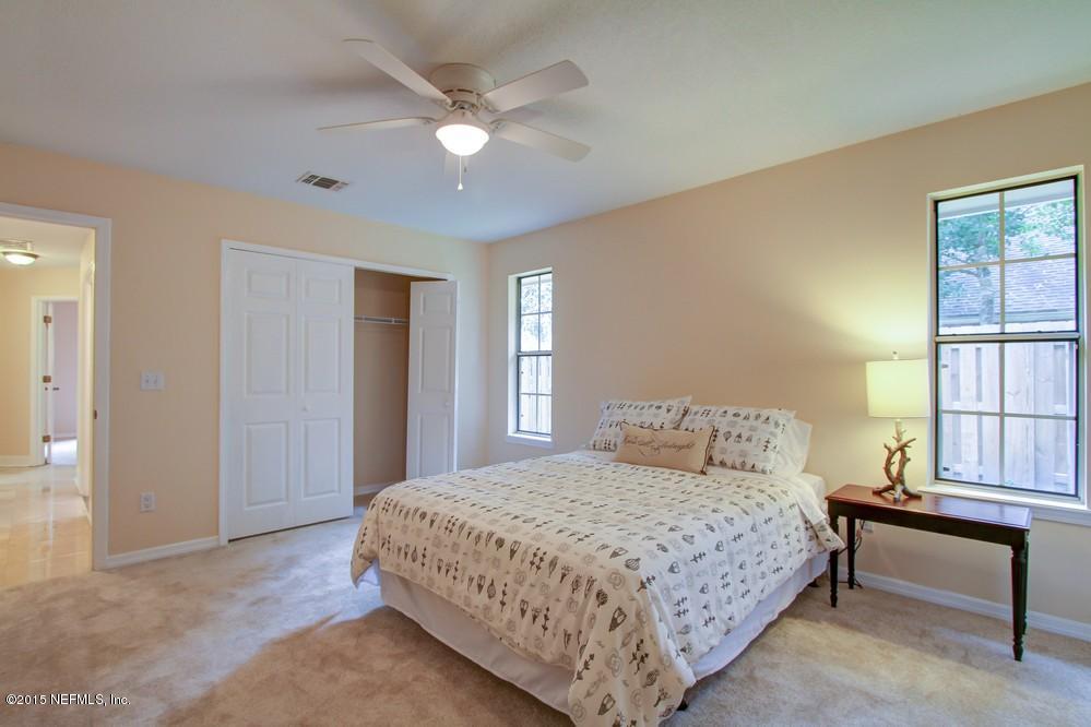3038 Nautilus Road Middleburg, FL 32068 - Photo 23 of 45 a bedroom with a bed and window