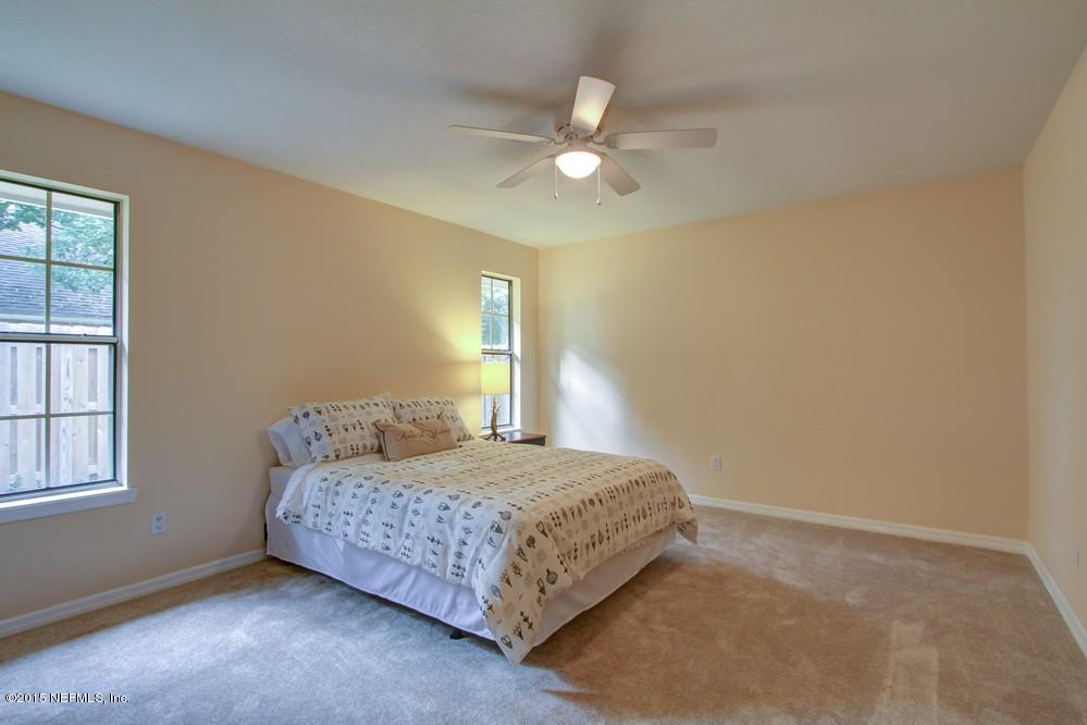 3038 Nautilus Road Middleburg, FL 32068 - Photo 24 of 45 a bedroom with a bed and window