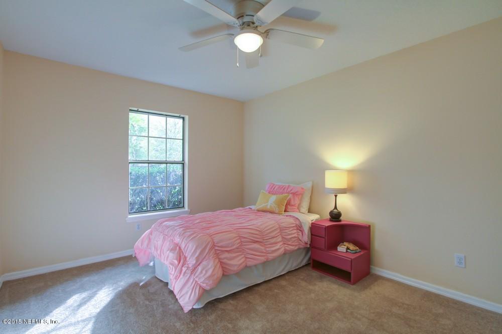 3038 Nautilus Road Middleburg, FL 32068 - Photo 25 of 45 a bedroom with a bed and a window